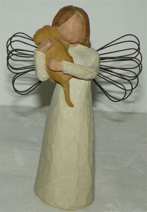 willow tree angel with dog|angel holding dog figurine.